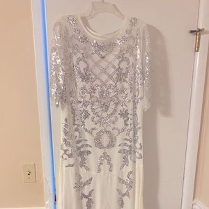 White dress with silver sequins. Bought off Amazon three years ago. Size 18.